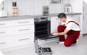 Technician repairing oven