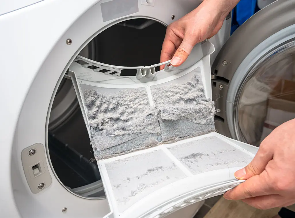 Tumble dryer removing dust and dirt trapped by the clothes dryer filter